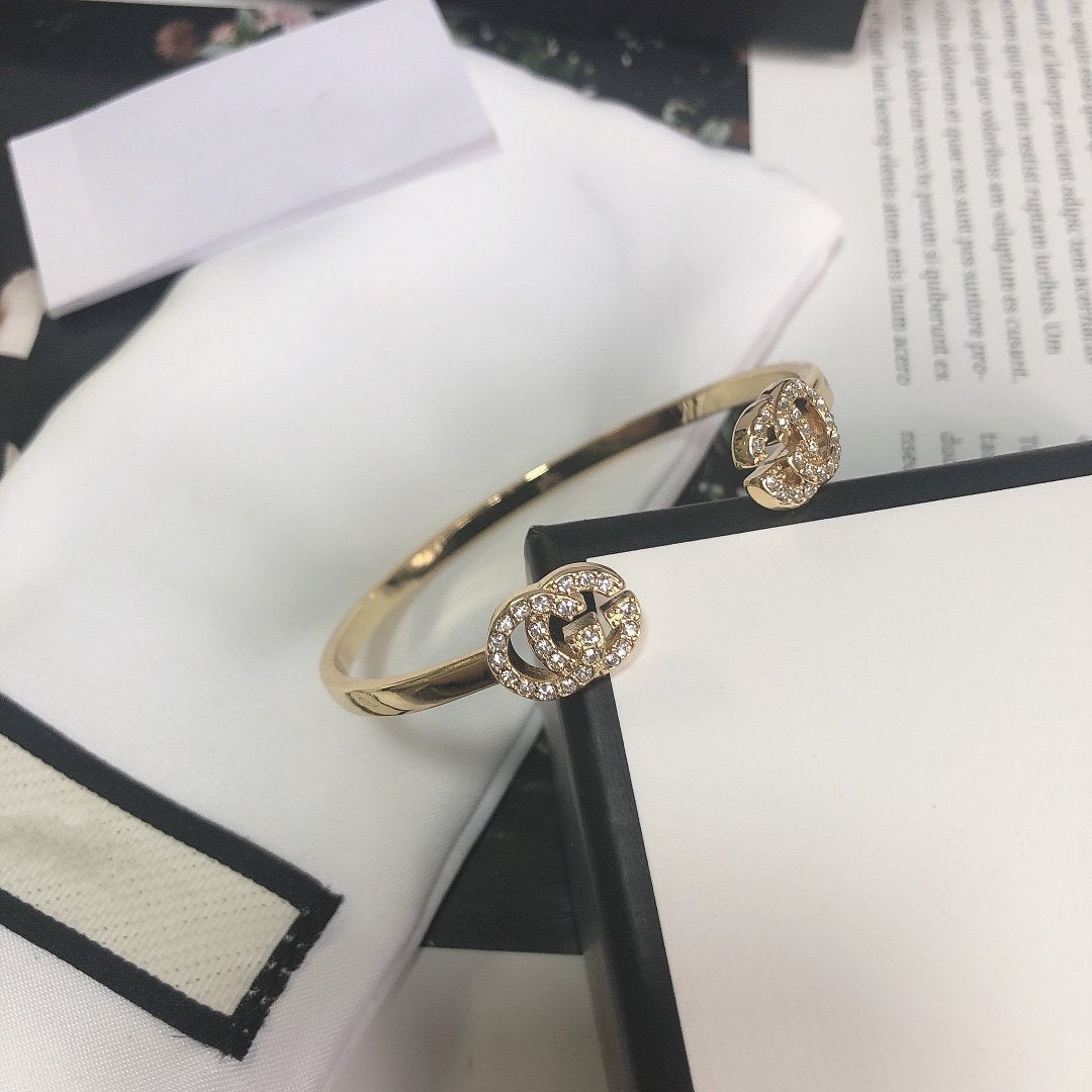 Gucci Gold Running Cubic Zirconia Logo Bangle Bracelets