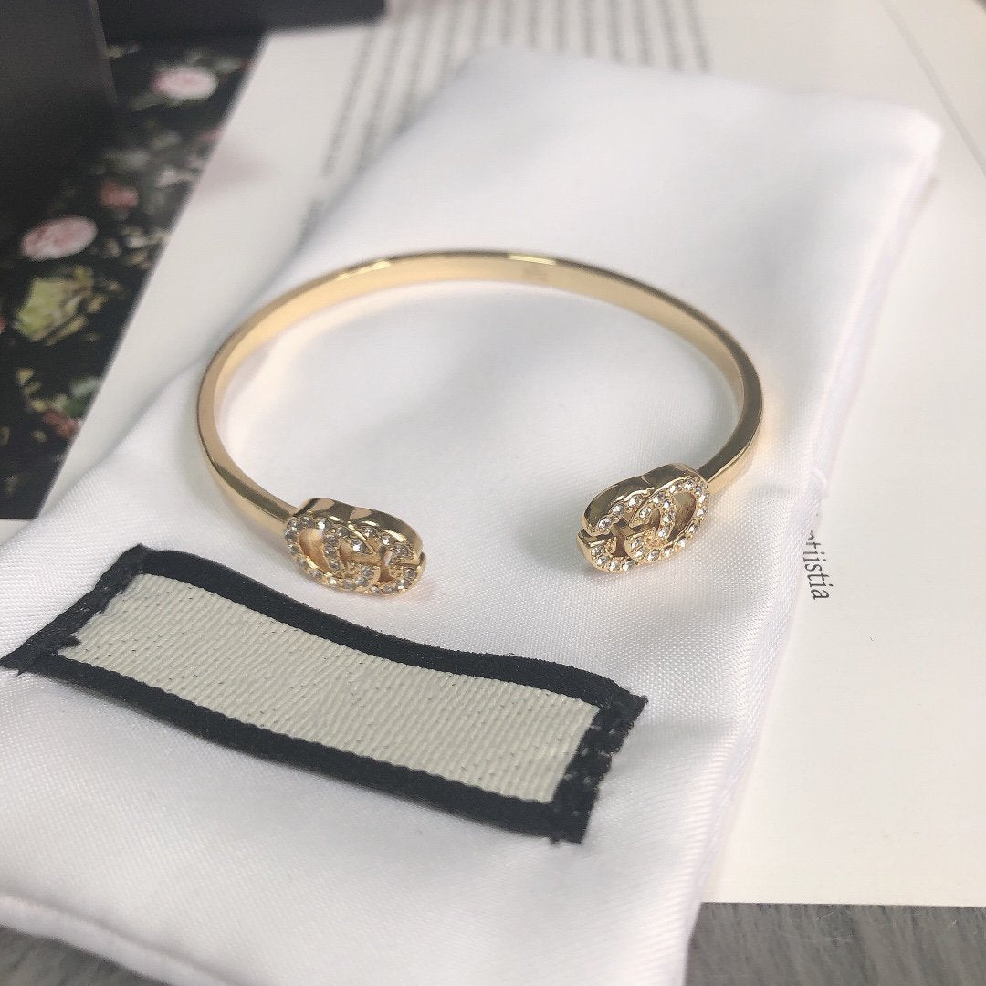 Gucci Gold Running Cubic Zirconia Logo Bangle Bracelets