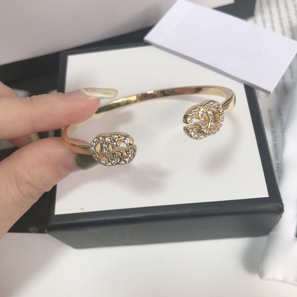 Gucci Gold Running Cubic Zirconia Logo Bangle Bracelets