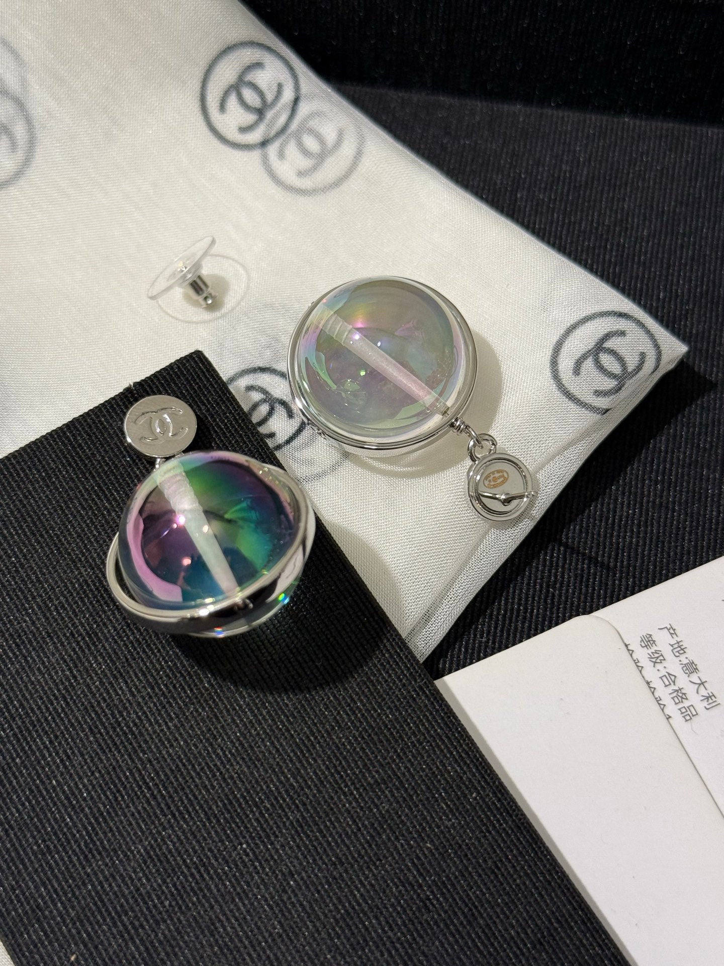 Chanel 2026 Transparent Iridescent Crystal Ball Planet Silver Button Double C Earrings